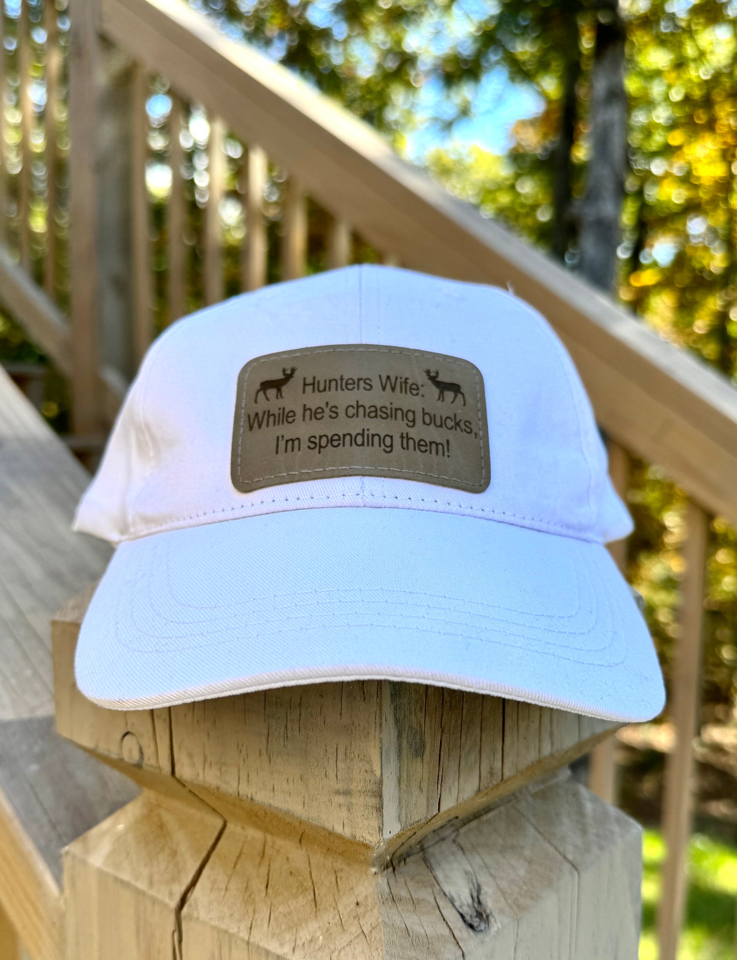 While He's Chasing Bucks, I'm Spending Them! - Hunters Wife Baseball Cap