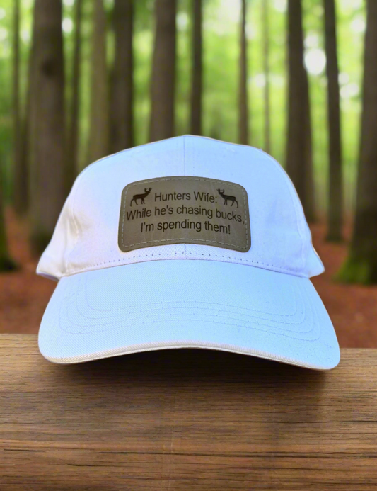 While He's Chasing Bucks, I'm Spending Them! - Hunters Wife Baseball Cap