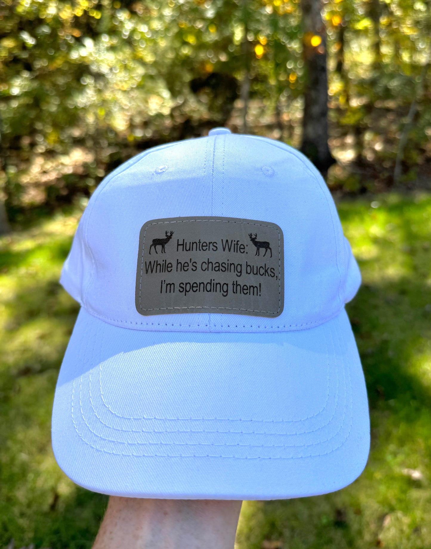 While He's Chasing Bucks, I'm Spending Them! - Hunters Wife Baseball Cap