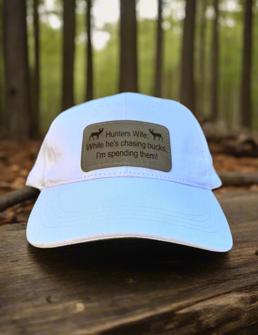 While He's Chasing Bucks, I'm Spending Them! - Hunters Wife Baseball Cap