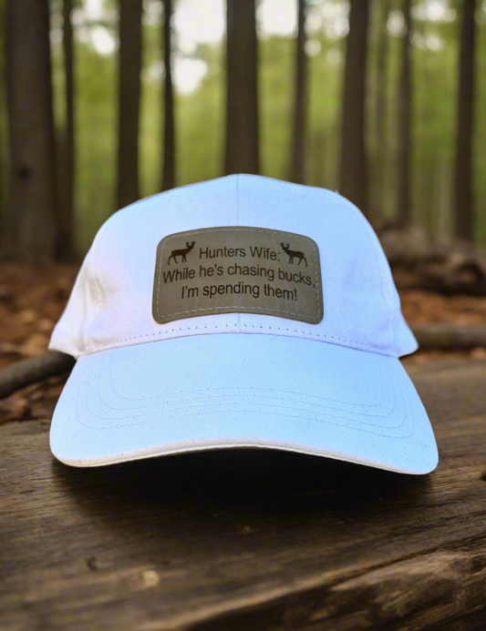 While He's Chasing Bucks, I'm Spending Them! - Hunters Wife Baseball Cap