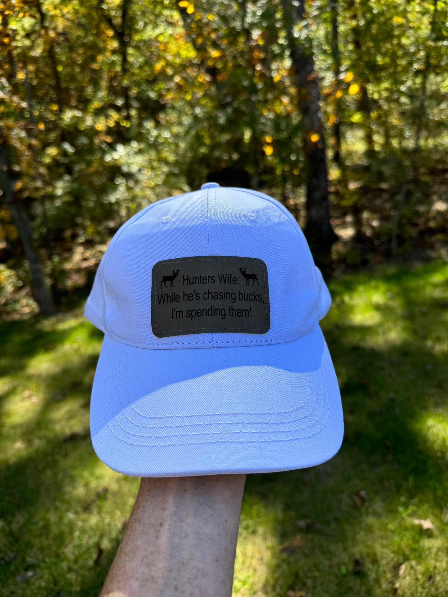 While He's Chasing Bucks, I'm Spending Them! - Hunters Wife Baseball Cap